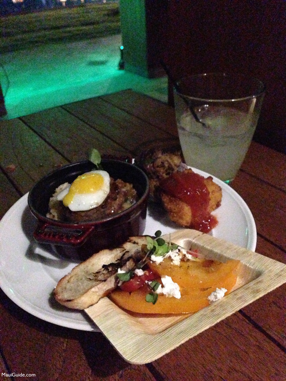 Plate of food and a cocktail at the Andaz Maui opening party in 2013