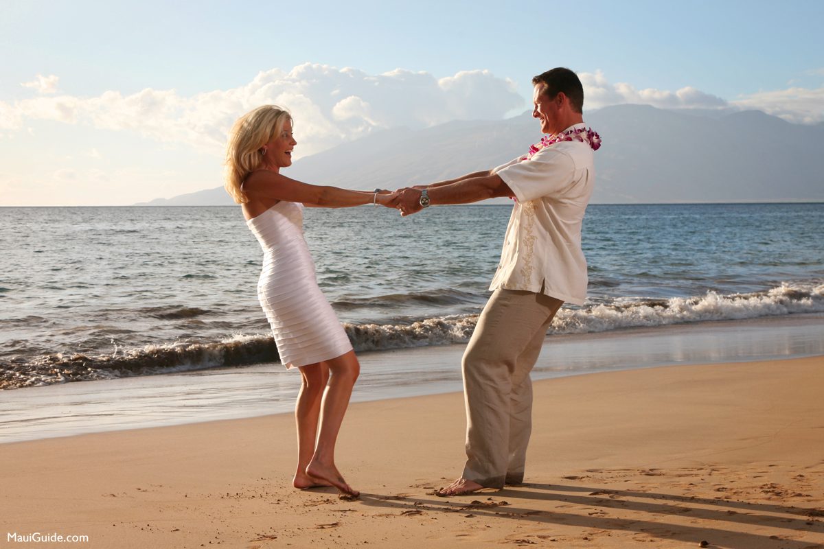 Bride and groom enjoying a Maui beach wedding