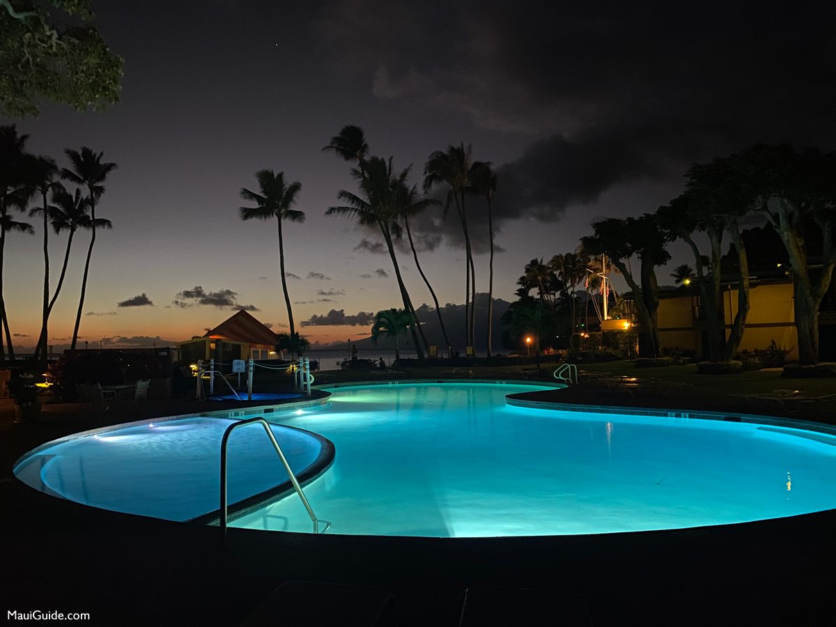 Illuminated pool and palms at Napili Kai Beach Resort